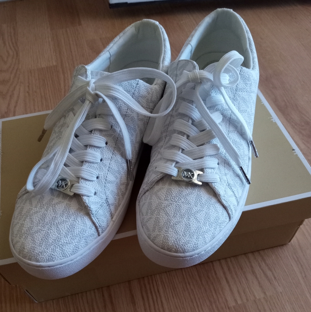 MK white women's shoe with silver logo
